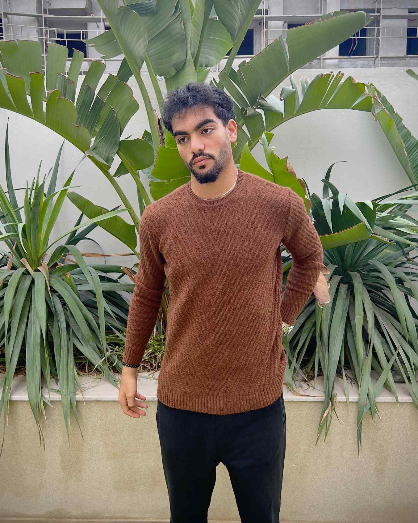 Man wearing a brown sweater 